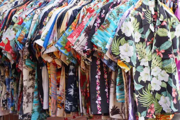 Hawaiian shirts on a rack in a market in Honolulu, Hawaii.
